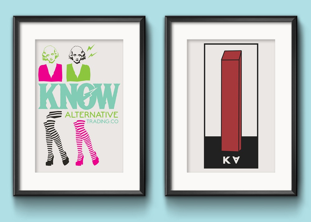 Two framed posters for Know Alternative Trading Company on a light blue wall. the left image is of twin women with short bob haircuts in neon blouses. They both wear striped knee high socks and platform heels. The right poster is of a red obelisk with a black frame around it. the letters "KA" are on the bottom, with the "A" upside down.
